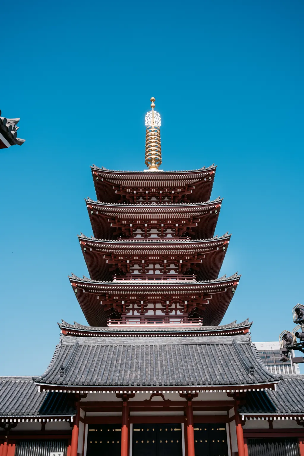 The five-storey pagoda at Senso-ji against a clear sky